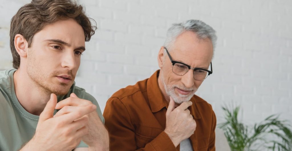 husband of family having addiction intervention with male son