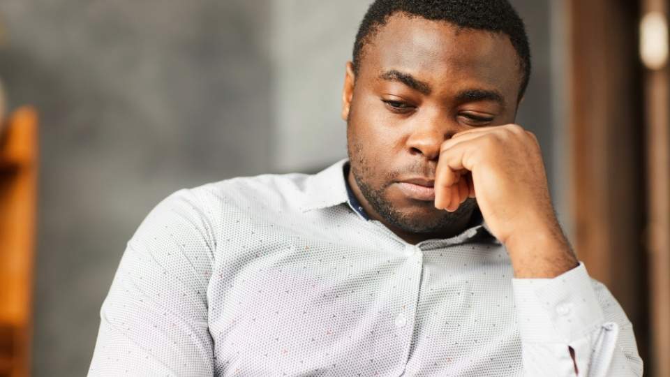 Can You Overdose on Kratom a man considers the answer to the question as they sit and stare.