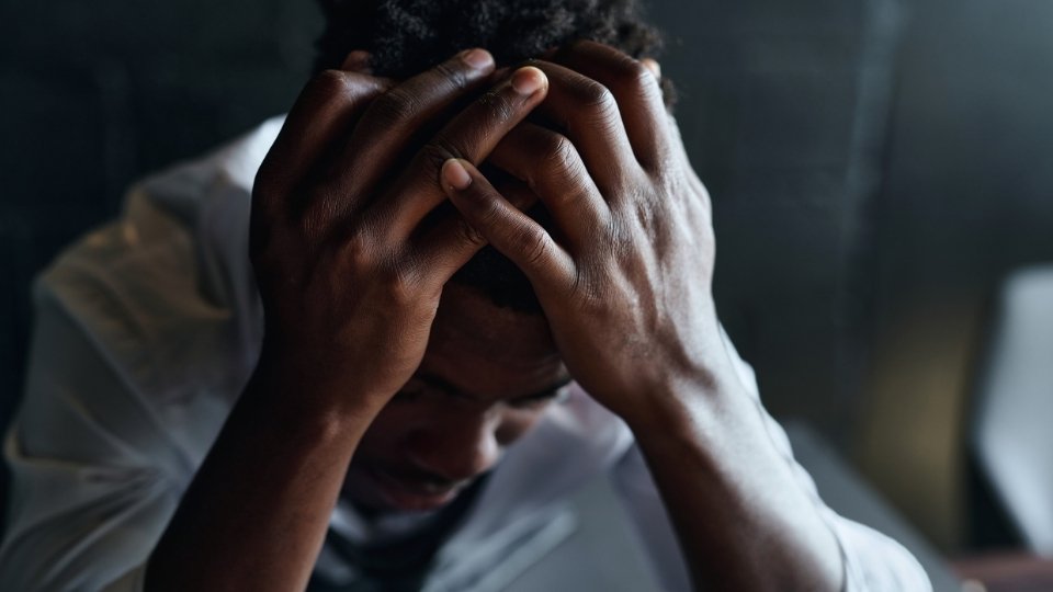 Is Lorazepam Addictive very much so, this man experiences the throes of addiction while covering his face.